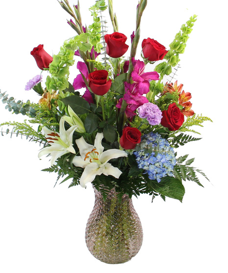 A floral work of art in our luxury collection, The Monet features hydrangea, Oriental lilies, Peruvian lilies, bells of Ireland, gladioli and more in a textured glass vase.