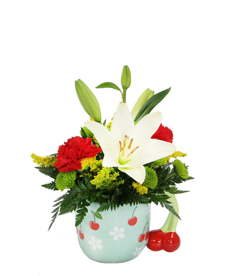 Two gifts in one! A bouquet featuring a white Asiatic lily complemented by vibrant red carnations and more in a ceramic cherry mug.  A perfect gift to brighten someone's day.