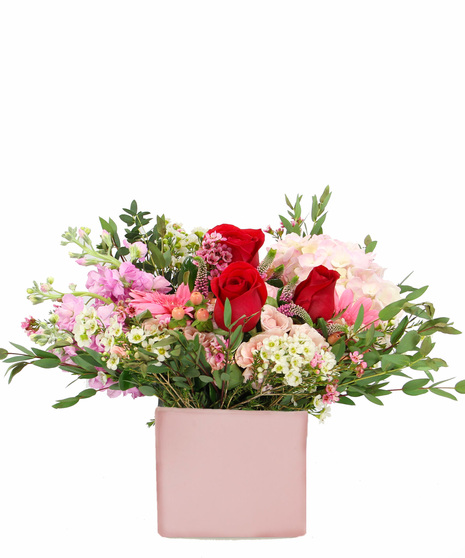 Celebrate the sweet side of love with our abundant bouquet in pinks.  Pink hydrangea, fragrant pink stock and more in a blush pink ceramic cube. 