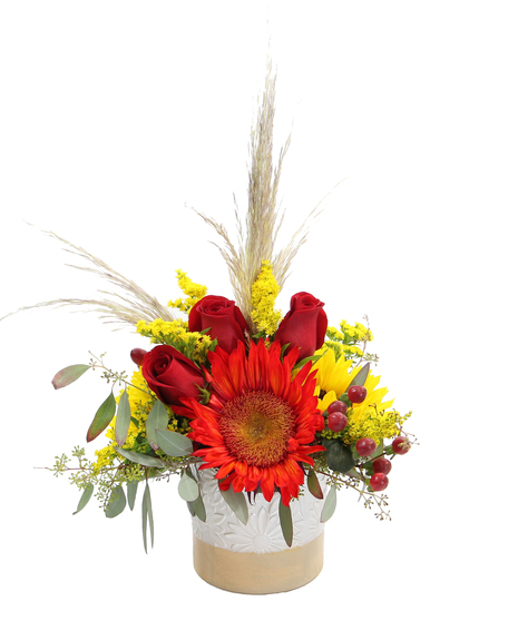  Rustic Charm brings together bold red and yellow sunflowers with soft pampas grass, seeded eucalyptus, and accents in a ceramic pot. 