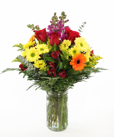 A bright bouquet designed to bring a pop of color and warmth into any space. Featuring snapdragons, mini gerbera daisies, daisy poms, and Peruvian lilies